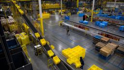 Bins move along a conveyor at an Amazon fulfillment center on Cyber Monday in Robbinsville, New Jersey, U.S., on Monday, Nov. 29, 2021.