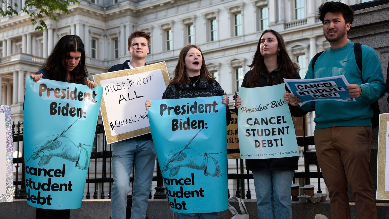 Activists attend a student loan debt forgiveness rally near the White House on Wednesday, April 27, 2022.