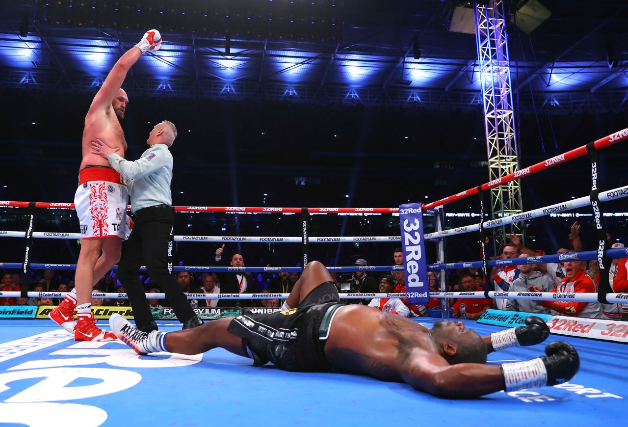 Tyson Fury celebrates after he knocked down Dillian White during their heavyweight title fight in London on Saturday, April 23. Fury finished White with an uppercut in the sixth round, and after the fight <a href="https://www.cnn.com/2022/04/24/sport/tyson-fury-retirement-dillian-whyte-spt-intl/index.html" target="_blank">he vowed he would retire.</a>