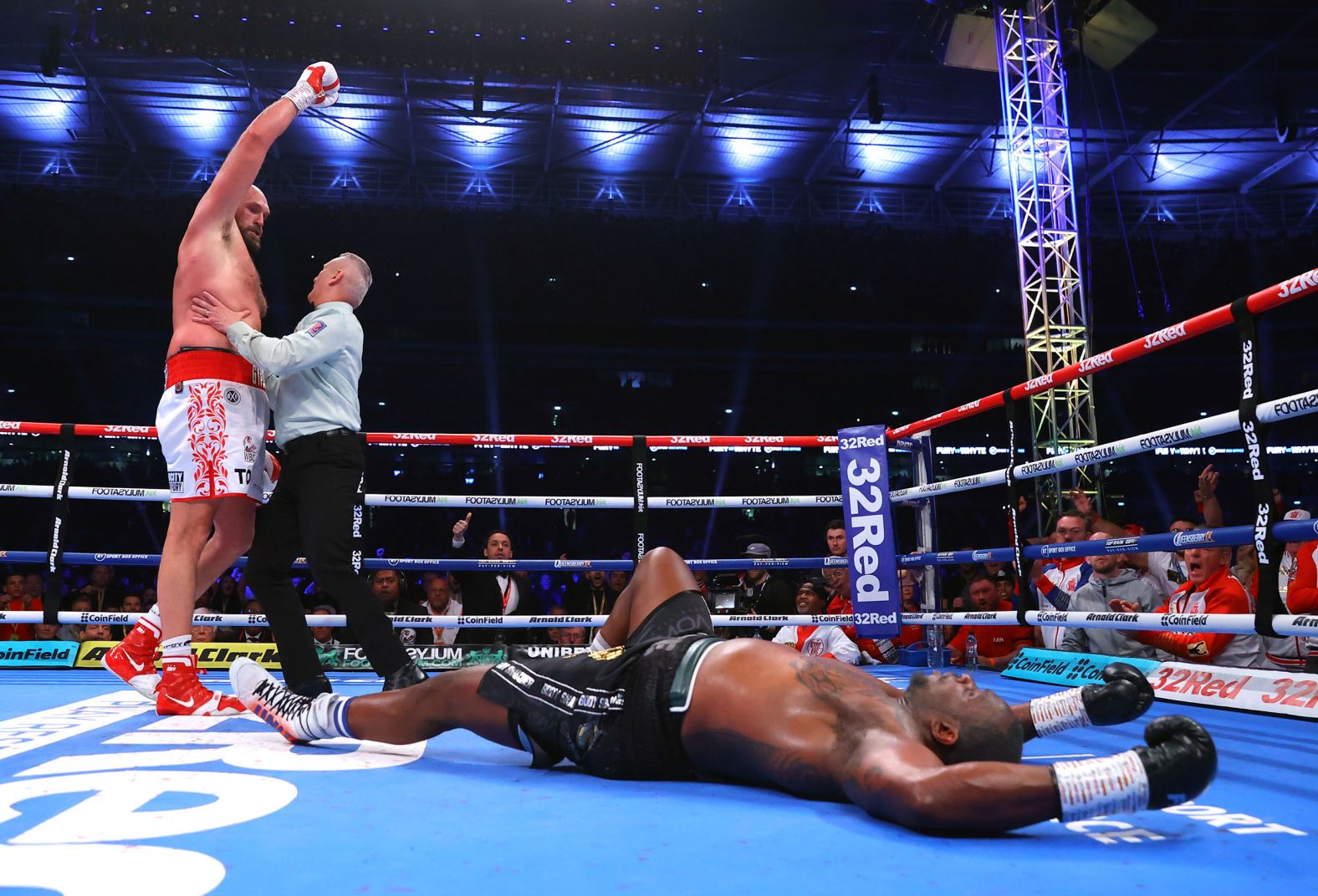 Tyson Fury celebrates after he knocked down Dillian White during their heavyweight title fight in London on Saturday, April 23. Fury finished White with an uppercut in the sixth round, and after the fight <a href="index.php?page=&url=https%3A%2F%2Fwww.cnn.com%2F2022%2F04%2F24%2Fsport%2Ftyson-fury-retirement-dillian-whyte-spt-intl%2Findex.html" target="_blank">he vowed he would retire.</a>