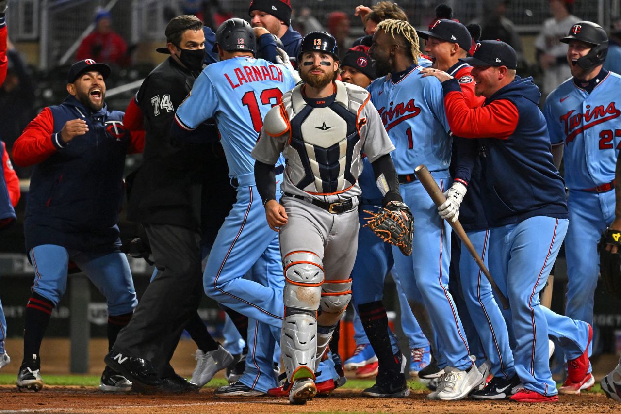 Detroit catcher Eric Haase walks off the field as the Minnesota Twins celebrate a walk-off win at a Major League Baseball game in Minneapolis on Tuesday, April 26. Haase's throwing error capped off a <a href="https://www.freep.com/story/sports/mlb/tigers/2022/04/26/detroit-tigers-game-recap-minnesota-twins-javier-baez/9547063002/" target="_blank" target="_blank">bizarre play</a> that gave the Twins the victory.