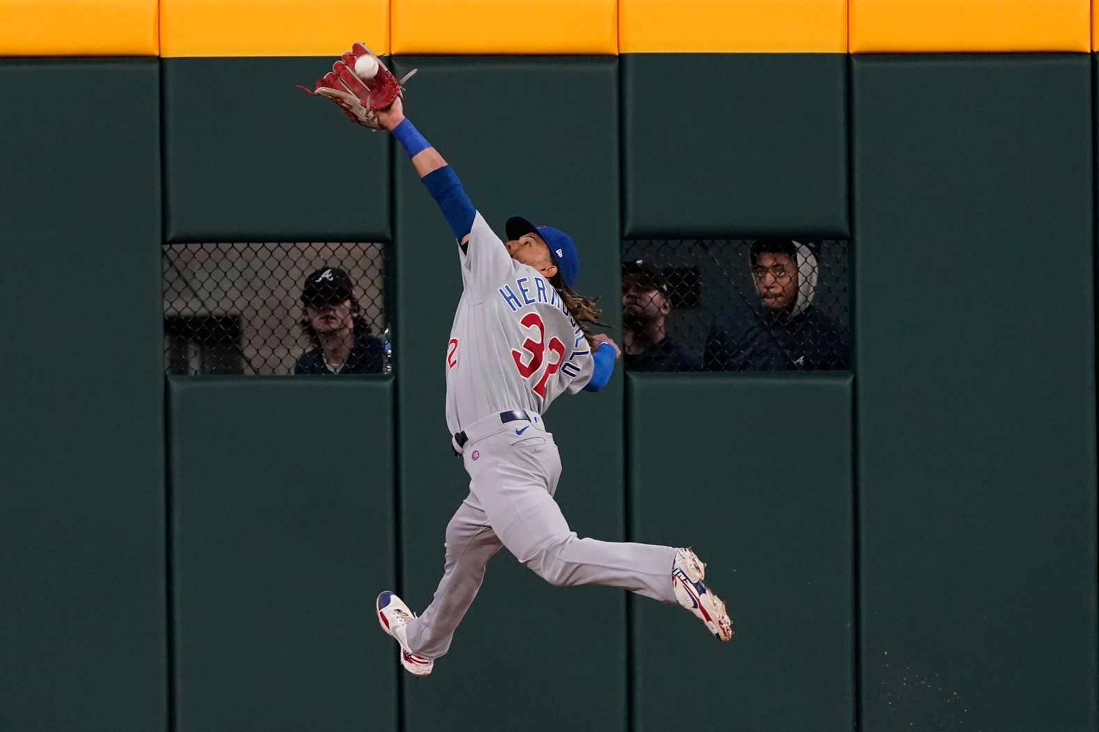 Chicago Cubs center fielder Michael Hermosillo catches a fly ball during a Major League Baseball game in Atlanta on Tuesday, April 26.