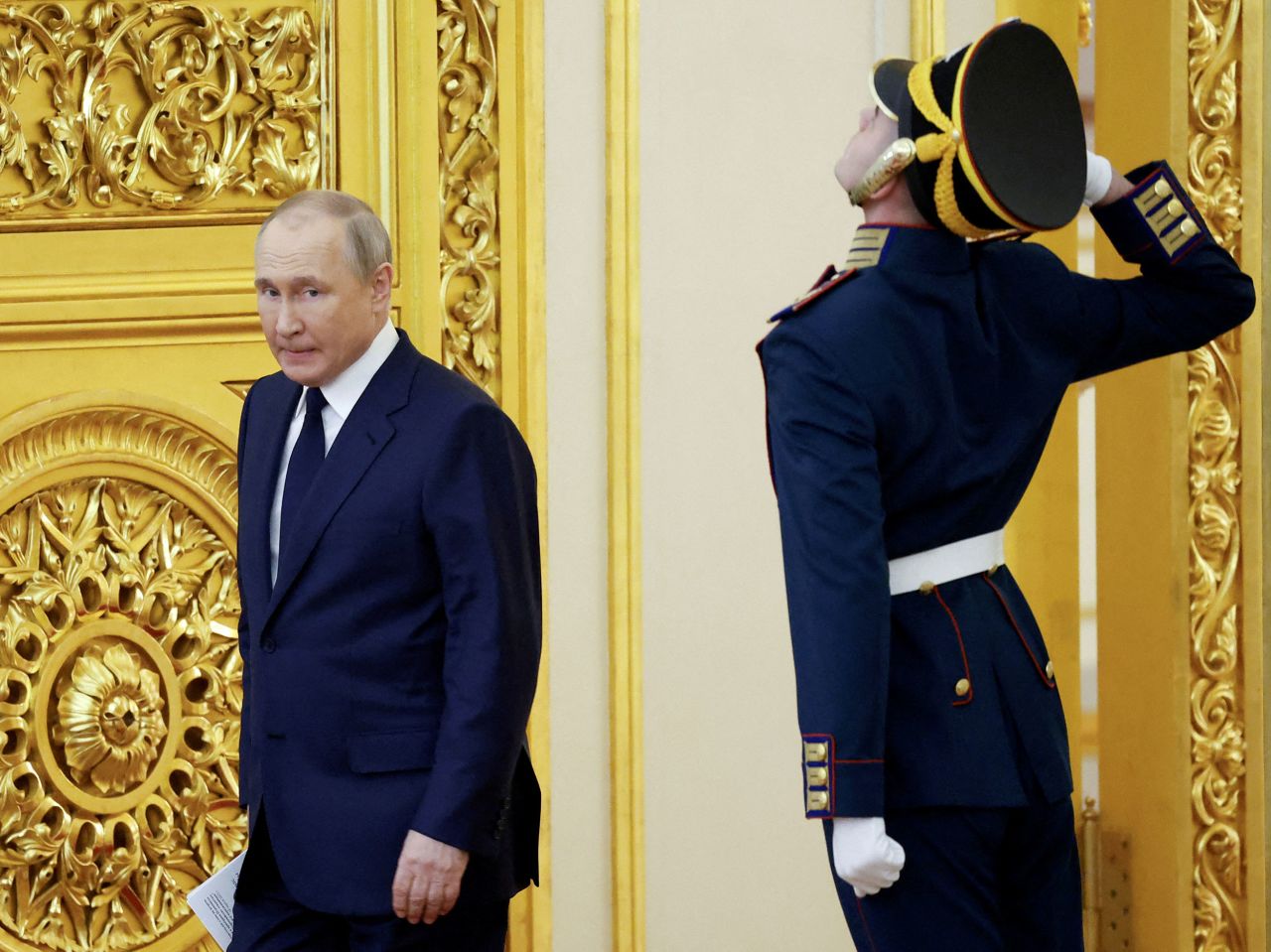 Russian President Vladimir Putin walks past a guard in Moscow during a ceremony at the Kremlin honoring the country's Olympians and Paralympians on Tuesday, April 26.