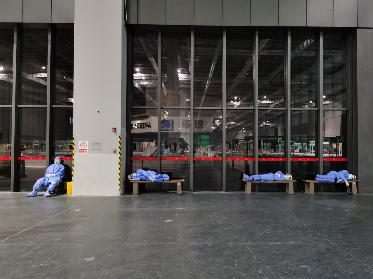 Nurses rest at a temporary hospital set up for Covid-19 patients in Shanghai, China, on Saturday, April 23. The city <a href="https://www.cnn.com/2022/04/19/china/shanghai-covid-lockdown-nightmare-intl-dst-hnk/index.html" target="_blank">has been under lockdown</a> since March.