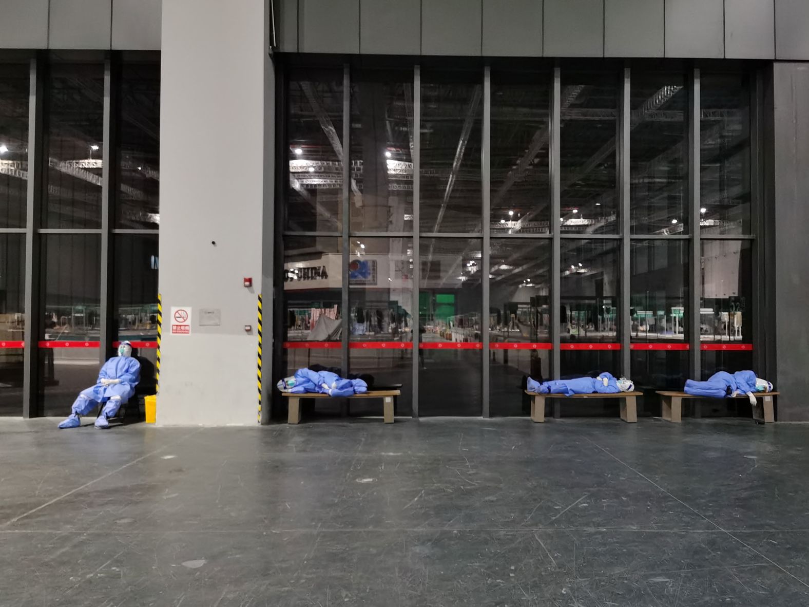 Nurses rest at a temporary hospital set up for Covid-19 patients in Shanghai, China, on Saturday, April 23. The city <a href="index.php?page=&url=https%3A%2F%2Fwww.cnn.com%2F2022%2F04%2F19%2Fchina%2Fshanghai-covid-lockdown-nightmare-intl-dst-hnk%2Findex.html" target="_blank">has been under lockdown</a> since March.