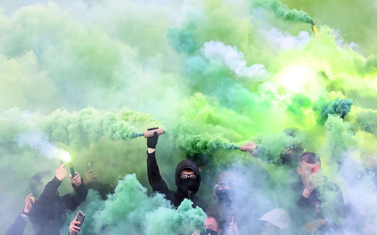 Supporters of the Irish soccer club Shamrock Rovers light flares before a match in Dublin on Friday, April 22.