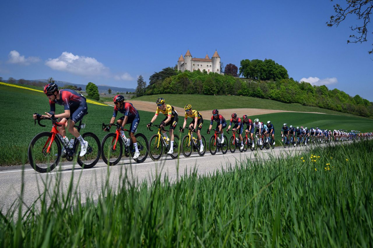 A pack of cyclists rides past the Champvent Castle in Switzerland during the first stage of the Tour de Romandie on Wednesday, April 27.