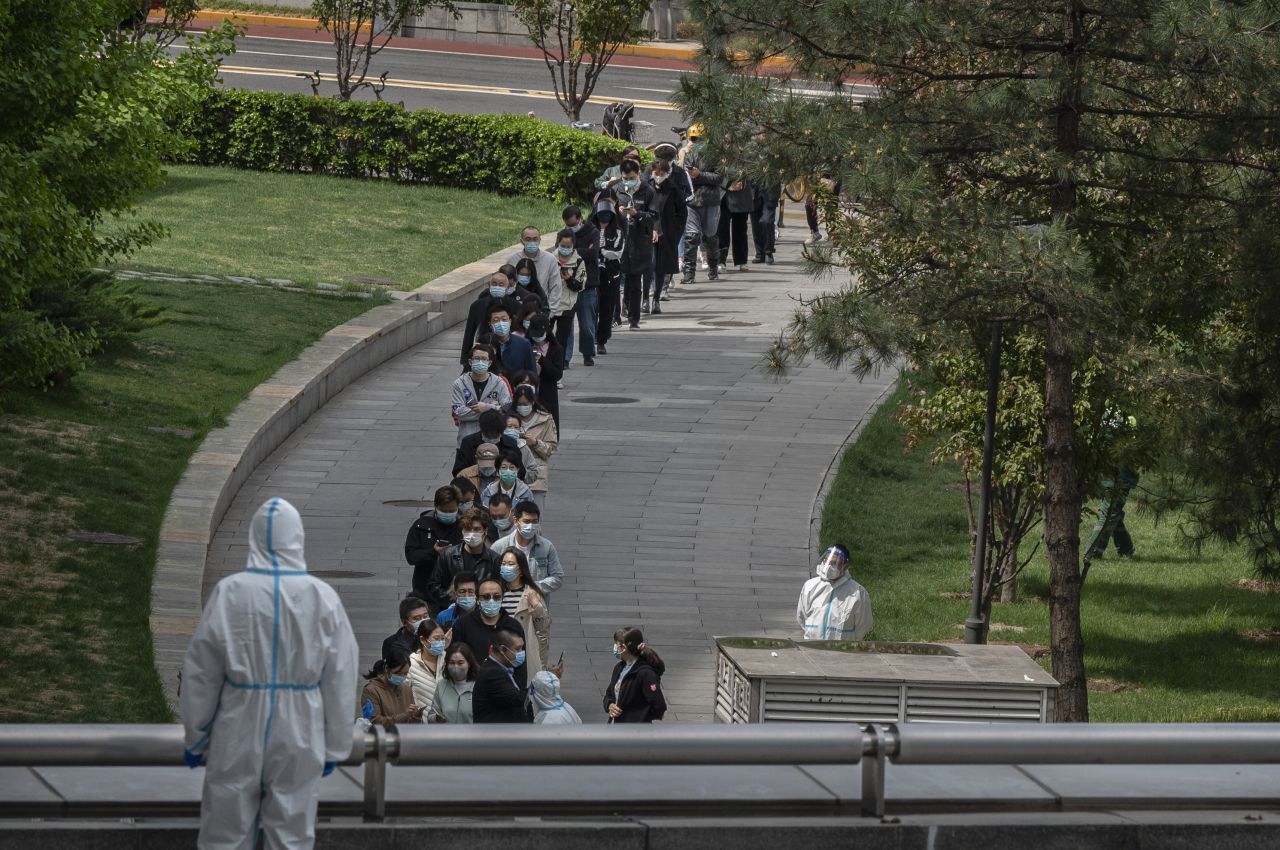 Office workers wait in line for a Covid test in Beijing on April 28.
