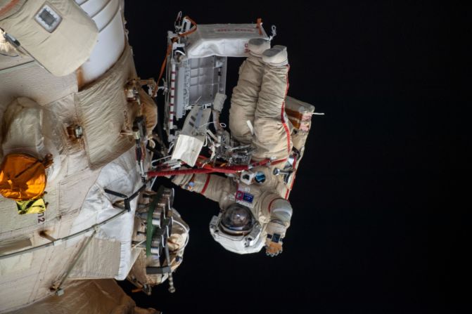 In this photo released by NASA on Saturday, April 23, Russian cosmonaut Oleg Artemyev waves to the camera while performing a spacewalk on April 18. <a href="index.php?page=&url=https%3A%2F%2Fwww.cnn.com%2F2022%2F04%2F28%2Fworld%2Frussian-spacewalk-robotic-arm-scn%2Findex.html" target="_blank">The spacewalk lasted for six hours and 37 minutes,</a> and it was for the configuration of a new robotic arm on the International Space Station's Russian segment.