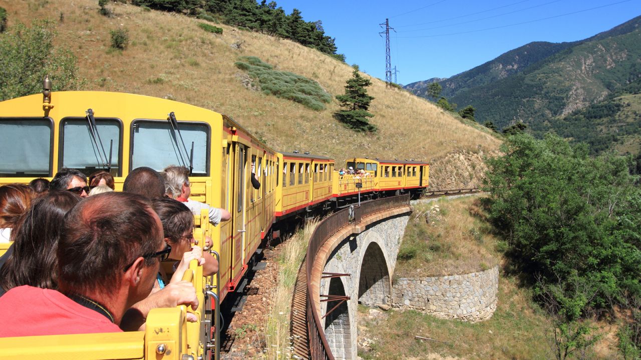 <strong>The Little Yellow Train, France: </strong>Hugging the sides of the deep, rocky valley of the River Tet in the Pyrenees mountains, the line winds between forests, chasms and gushing streams, passing traditional villages, historic fortresses and a precariously perched hermitage.
