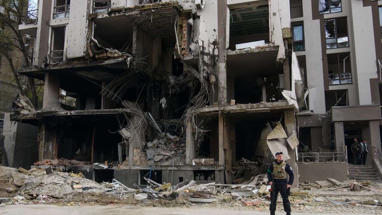 Ukrainian serviceman stands close to the rubble of an apartment block destroyed in a rockets shelling, amid Russia's invasion of Ukraine, in Kyiv, Ukraine April 29, 2022 (Photo by Maxym Marusenko/NurPhoto via Getty Images)