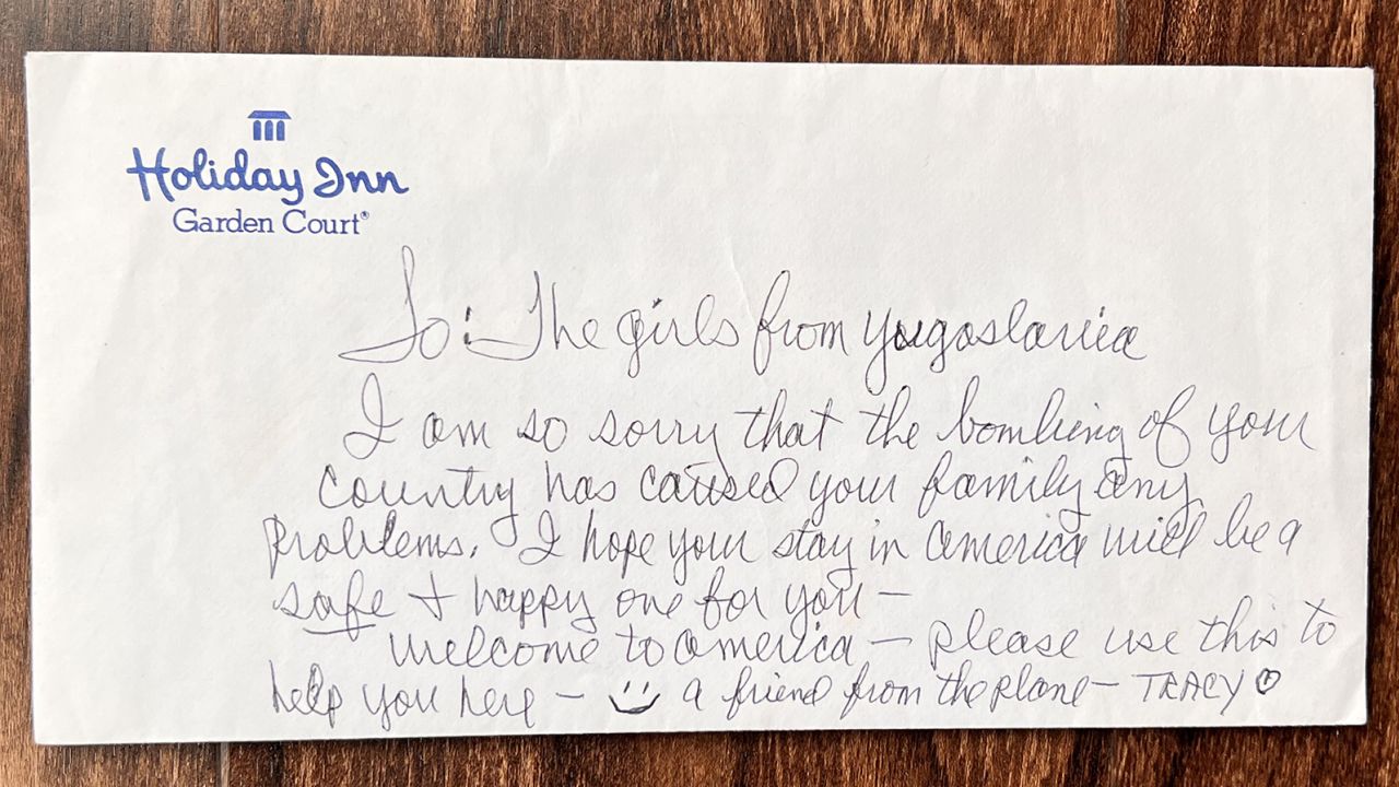 Tracy Peck wrote this note on the envelope she handed the sisters on the airplane. It took them two decades to learn her identity.