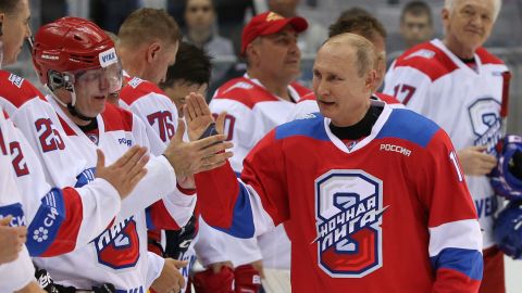At a gala hockey match in Sochi, Russia, in 2019, Russian President Vladimir Putin greets businessman Vladimir Potanin who has donated millions to western institutions.