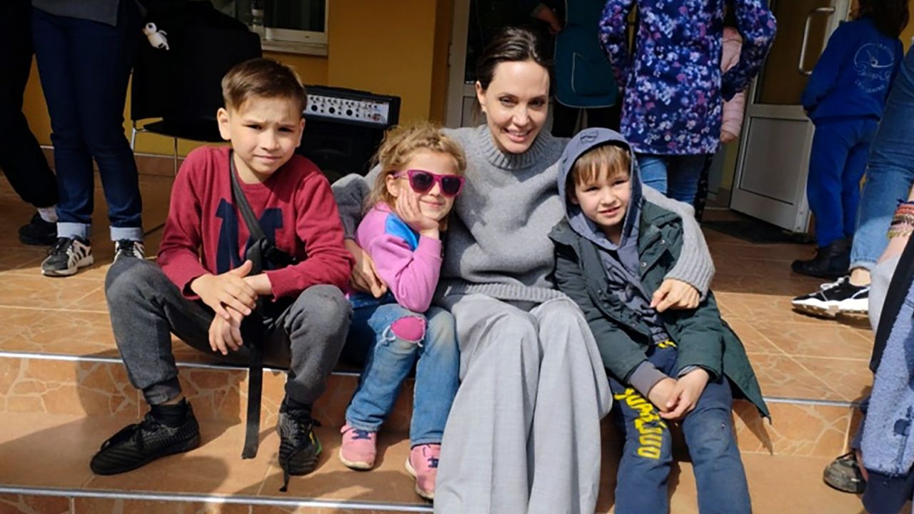 Angelina Jolie poses for photo with children in Lviv, Ukraine, on Saturday, April 30, 2022. 