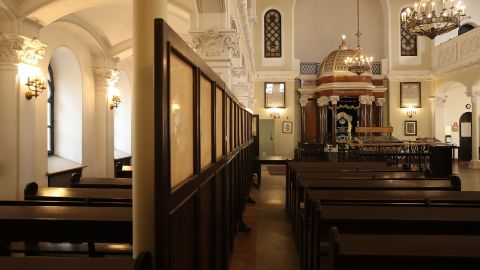 At left, the women's worship area in the Nożyk Synagogue in Warsaw as seen on April 12, 2018.