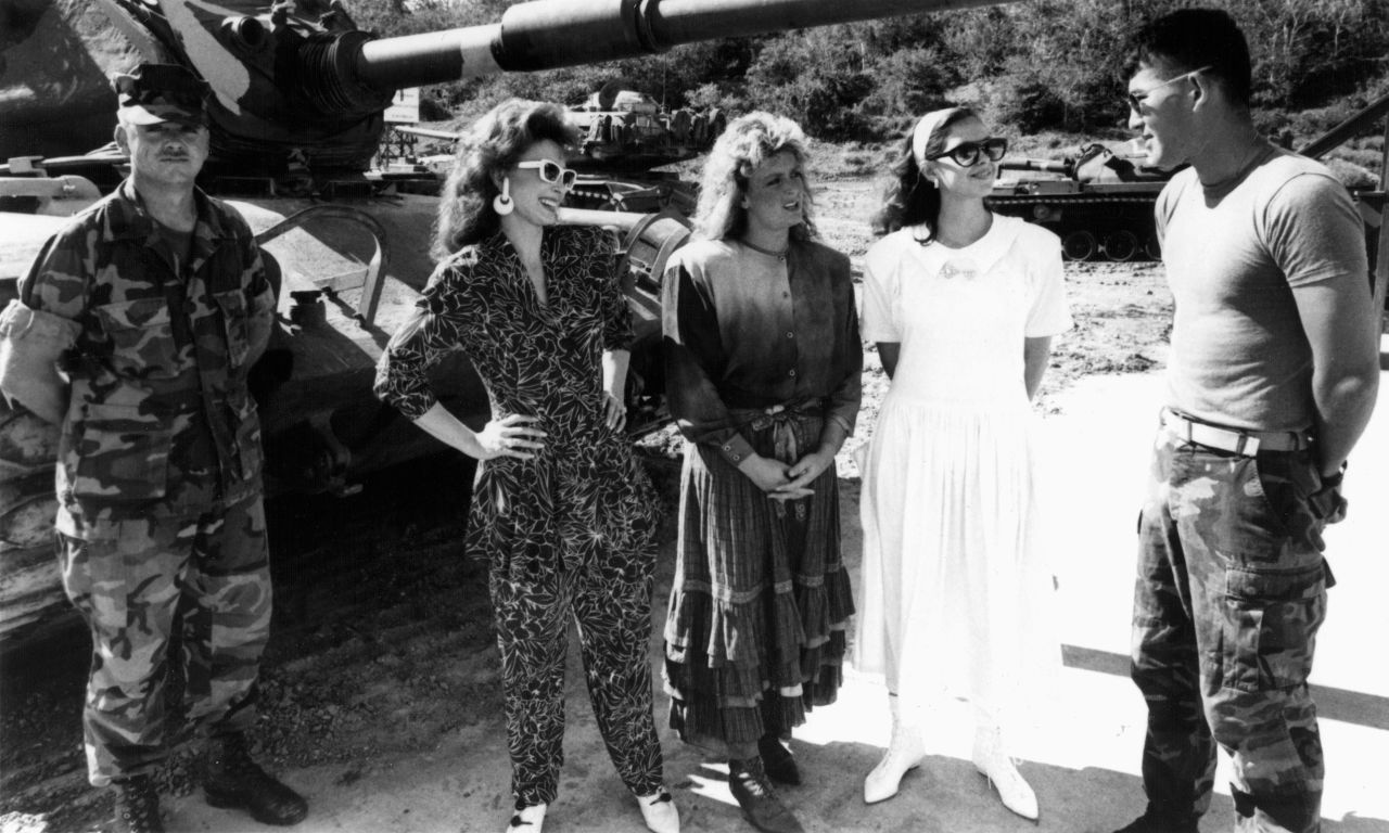 Judd, with daughters Wynonna Judd and Ashley Judd, greets U.S. Marines at Guantanamo Bay Naval Base in Cuba, around 1988.
