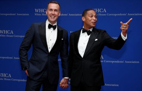 CNN anchor Don Lemon, right, and his partner Tim Malone pose for photos on the red carpet.