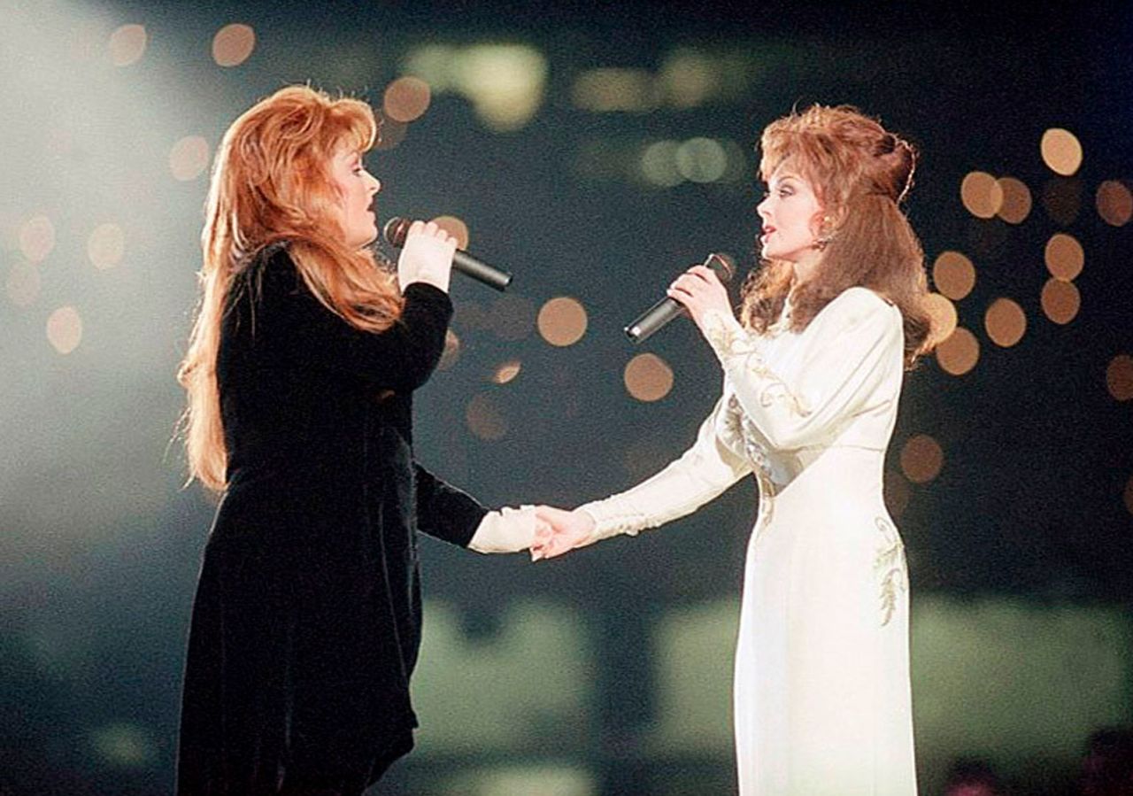 Wynonna Judd, left, and Naomi Judd perform during the halftime show at Super Bowl XXVIII in Atlanta on January 30, 1994.