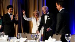 President Joe Biden and first lady Jill Biden arrive at the annual White House Correspondents' Association dinner, Saturday, April 30, 2022, in Washington. At left is comedian Trevor Noah. (AP Photo/Patrick Semansky)