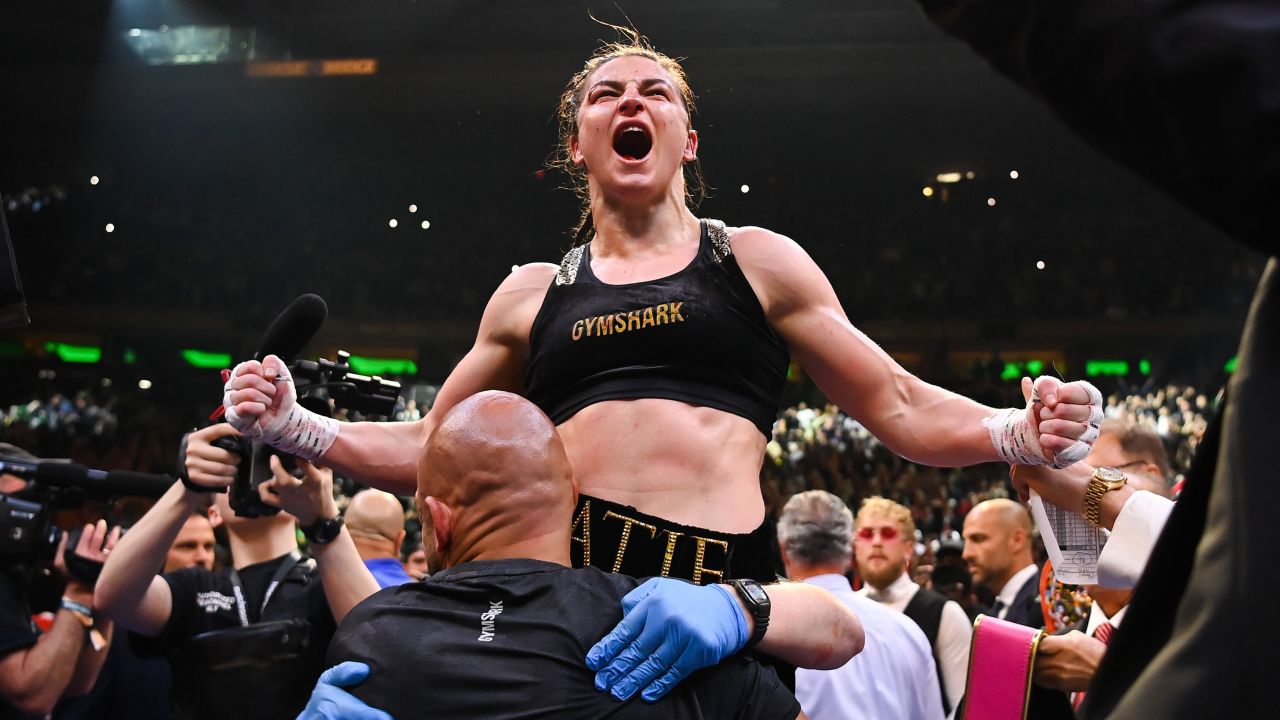 Taylor celebrates victory after her undisputed world lightweight championship fight with Serrano.