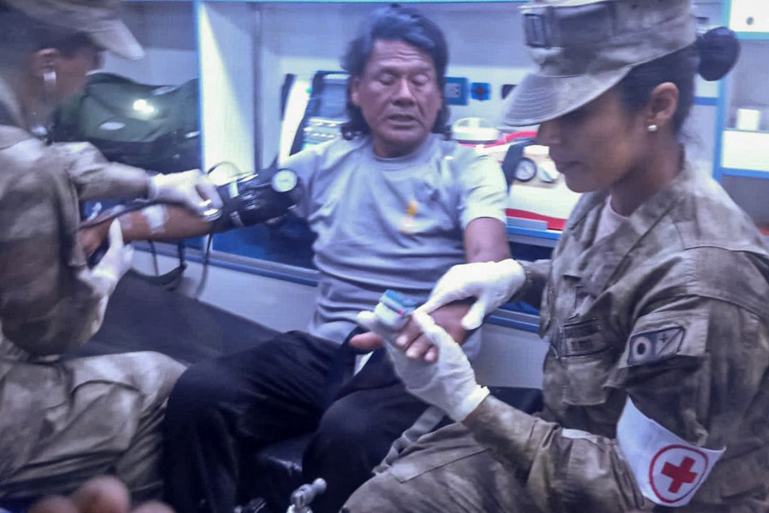 This handout picture released on March 15, 2025, by the Peruvian Navy shows Peruvian fisherman Maximo Napa, 61, receiving medical attention upon his arrival in Paita, Piura department, Peru.