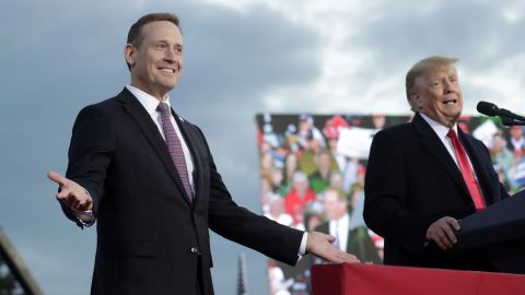 Rep. Ted Budd, left, reacts as he takes the stage with Trump in North Carolina.