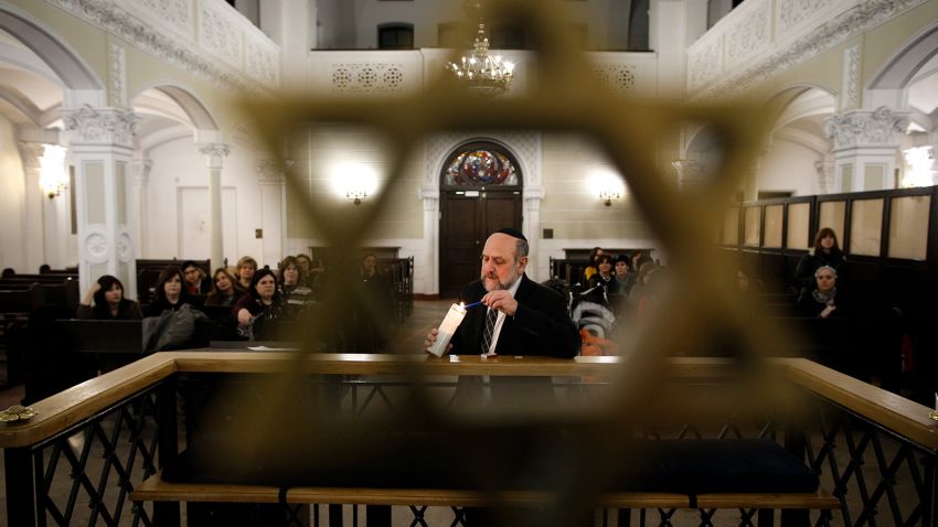 Chief Rabbi of Poland Michael Shudrich lights a candle on International Holocaust Remembrance Day at the Nozyk synagogue in Warsaw, Poland on January 27, 2019. (Photo by Jaap Arriens/NurPhoto via Getty Images)