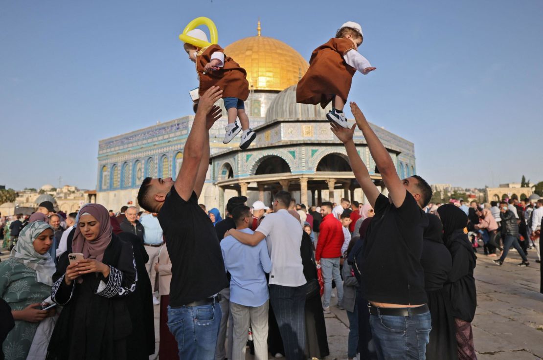 Muslims play with their children in front of the Dome of the Rock after the morning Eid al-Fitr prayer, which marks the end of the holy fasting month of Ramadan, at the Al-Aqsa mosque compound in Jerusalem's Old City early on May 2. 