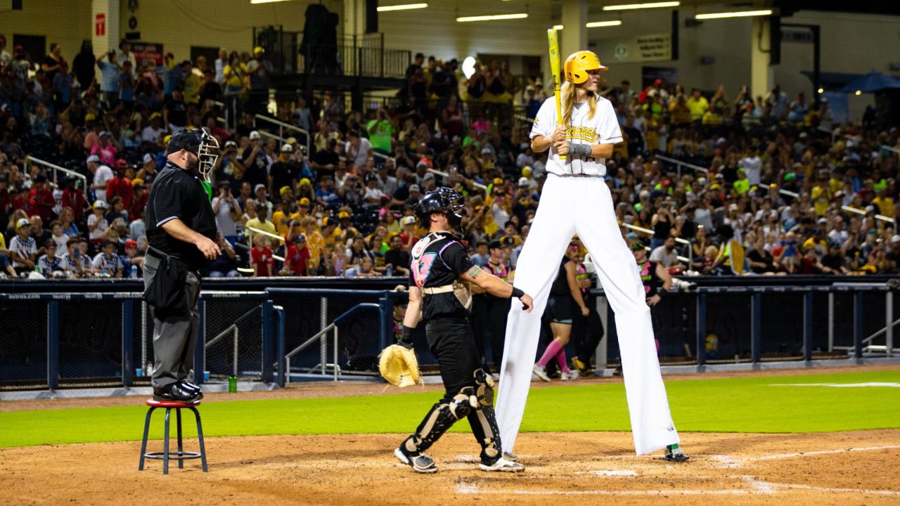 A Bananas player steps up to bat in stilts.