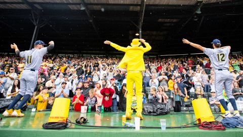 Jesse Cole, center, hypes up the crowd.