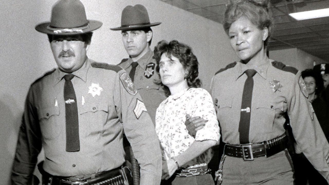 In this Nov. 21, 1981 file photo, Weather Underground member Katherine Boudin is led from Rockland County Courthouse in New City, New York, by sheriff's officers.