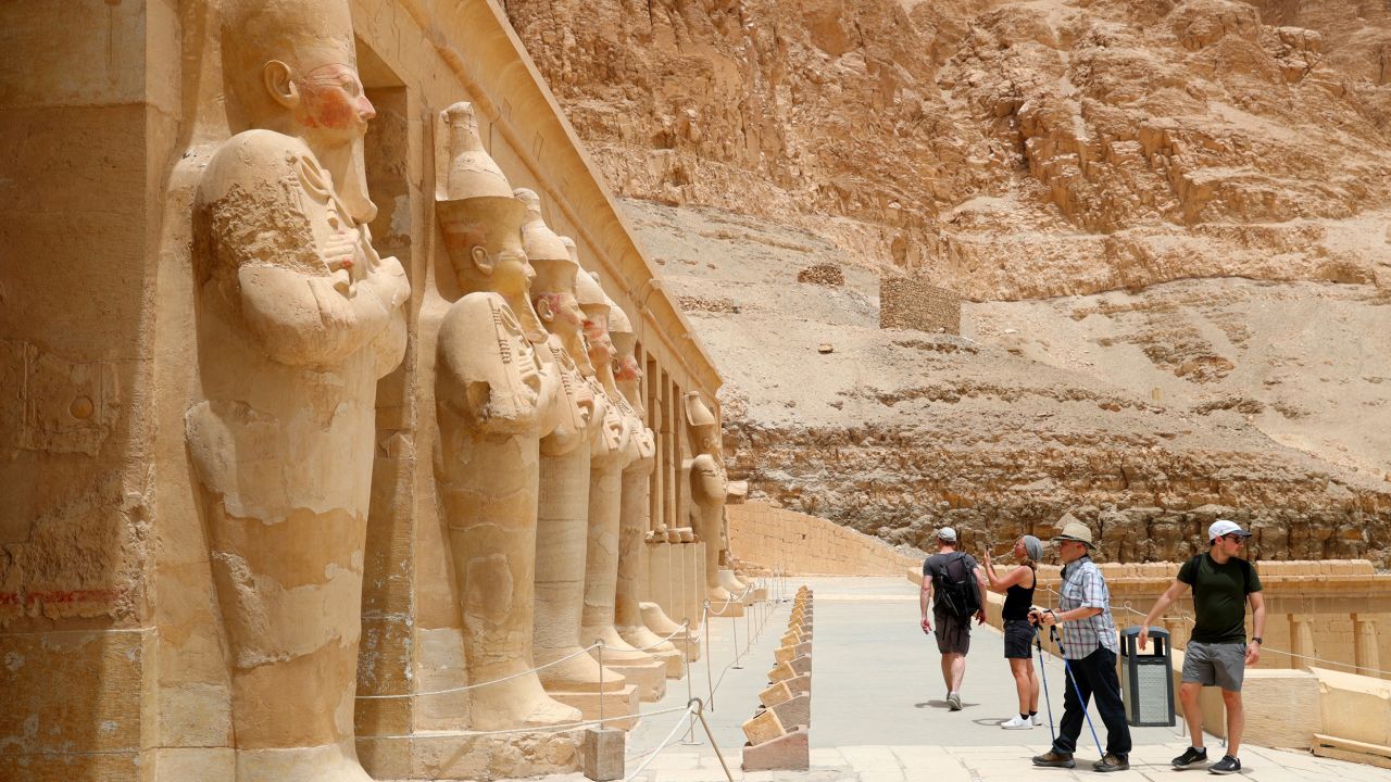 Tourists visit the Temple of Hatshepsut in Luxor on April 26, 2022.  Egypt was placed into the "unknown" risk category on Monday.