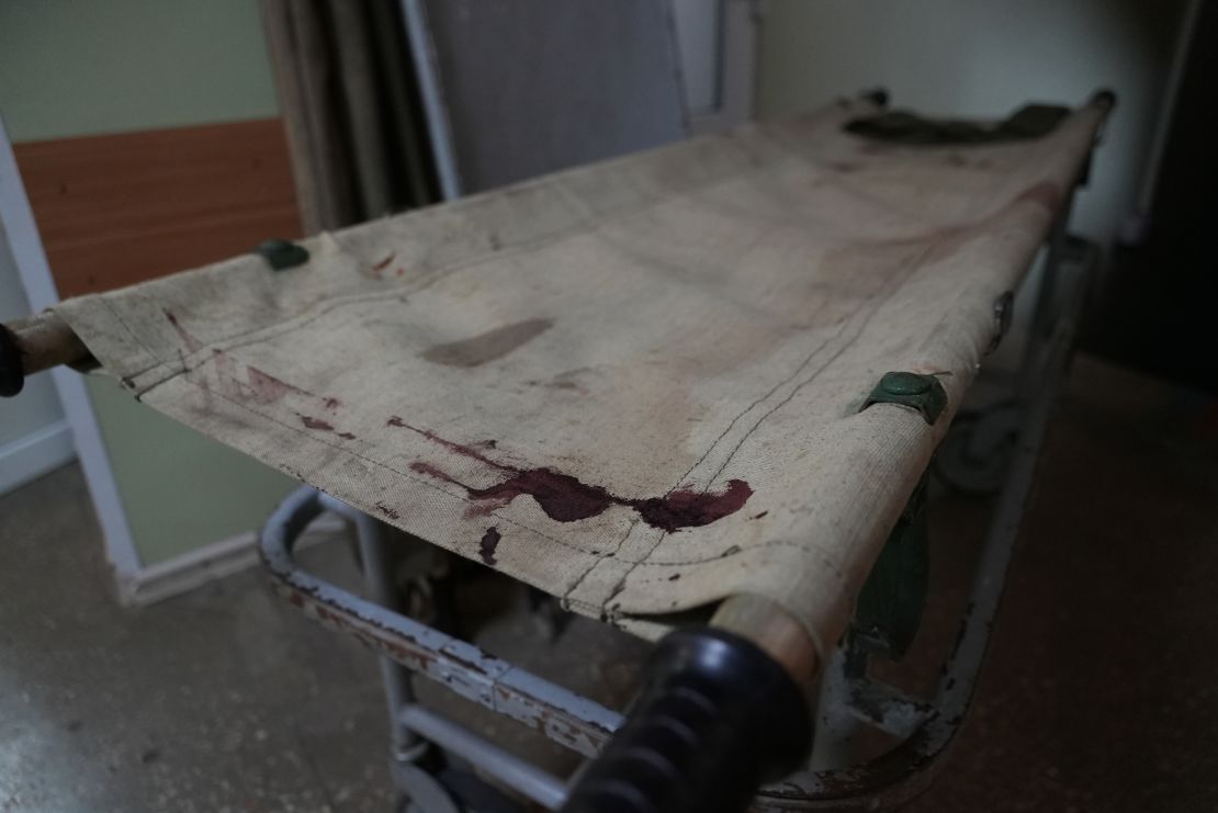 A bloody gurney lies in the hallway of a hospital in Bakhmut.