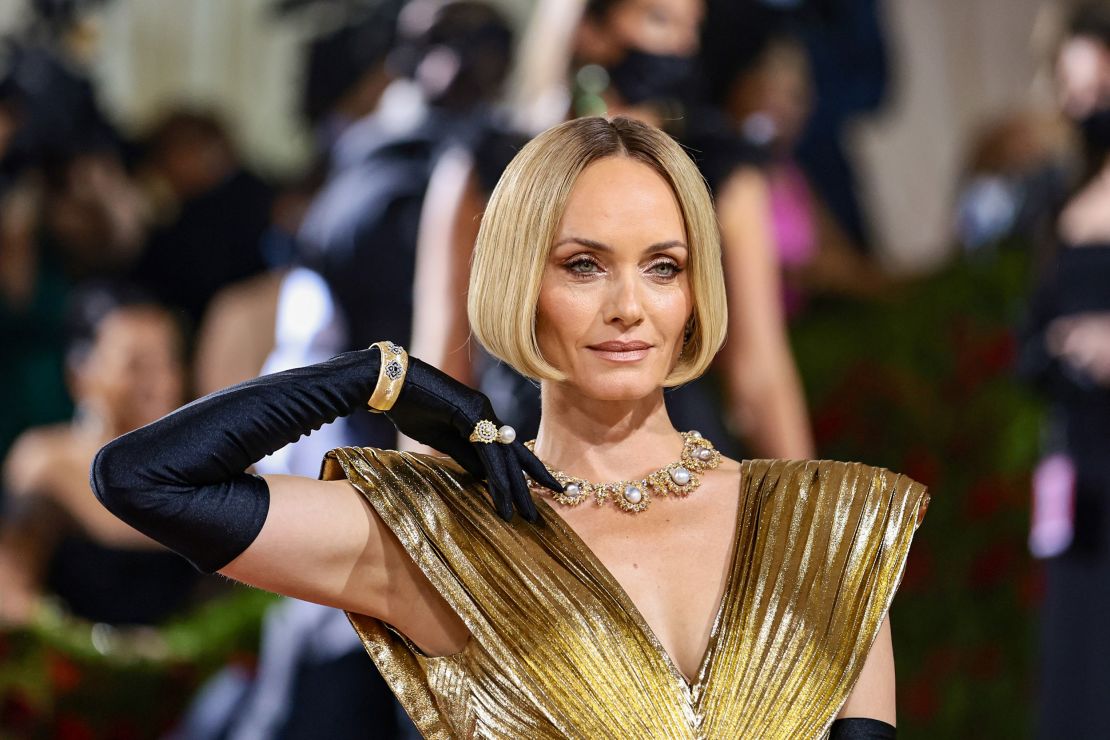 Amber Valletta's pleated gold gown was actually a vintage piece from the Azzaro label's archive. 