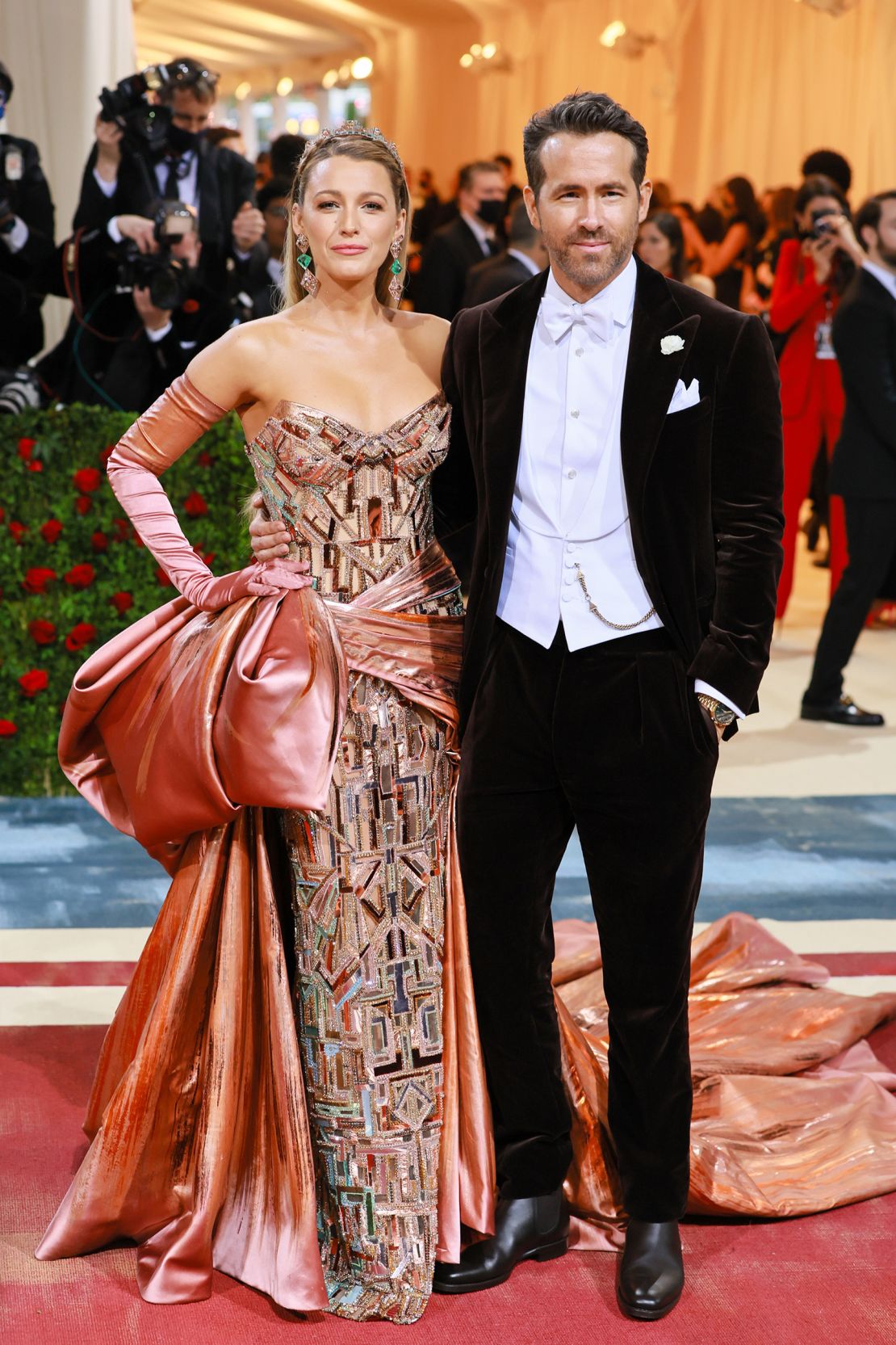 Actors Blake Lively and Ryan Reynolds embraced the theme, with Lively in a glittering Versace beaded gown with an oversized coppery satin bow and matching gloves, and Reynolds in a classic tuxedo.