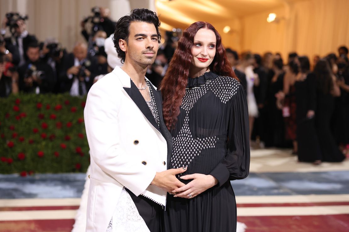 Joe Jonas and Sophie Turner both wore Louis Vuitton, with Jonas sporting a white womenswear jacket and Turner in a long-sleeved embroidered dress. 