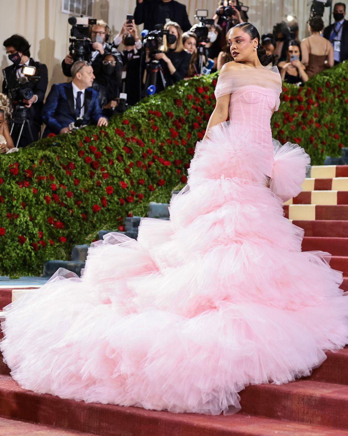 Tessa Thompson's pink Carolina Hererra gown featured one of the evening's most dramatic trains. She completed the look with vegan Piferi boots.