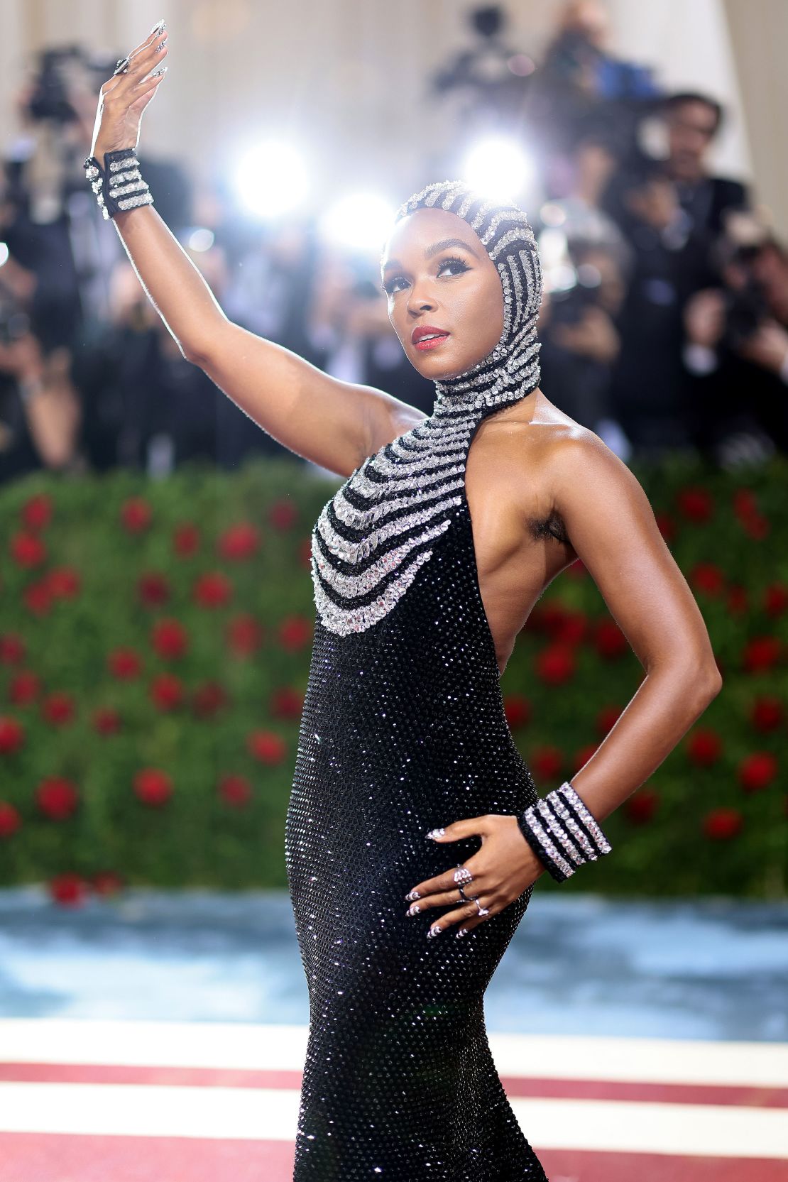 While many celebrities opted for tiaras, singer Janelle Monáe went for a full glimmering gown with a full blinged-out headpiece and matching wrist cuffs.