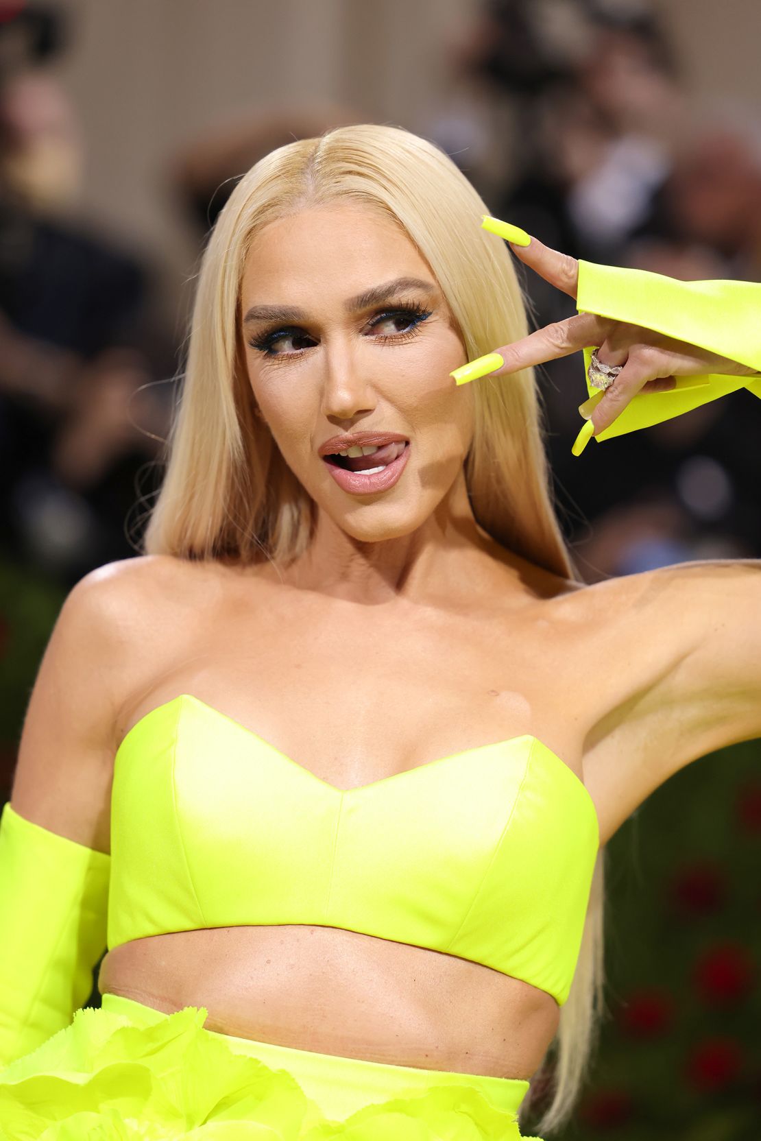 Gwen Stefani opted for a neon ensemble by Vera Wang. 
