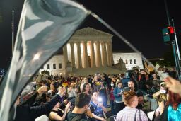 Anti-abortion activists and abortion rights proponents gather outside the Supreme Court in Washington on Monday.