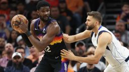 PHOENIX, ARIZONA - MAY 02: Deandre Ayton #22 of the Phoenix Suns handles the ball against Maxi Kleber #42 of the Dallas Mavericks during the first half of Game One of the Western Conference Second Round NBA Playoffs at Footprint Center on May 02, 2022 in Phoenix, Arizona.  NOTE TO USER: User expressly acknowledges and agrees that, by downloading and or using this photograph, User is consenting to the terms and conditions of the Getty Images License Agreement. (Photo by Christian Petersen/Getty Images)