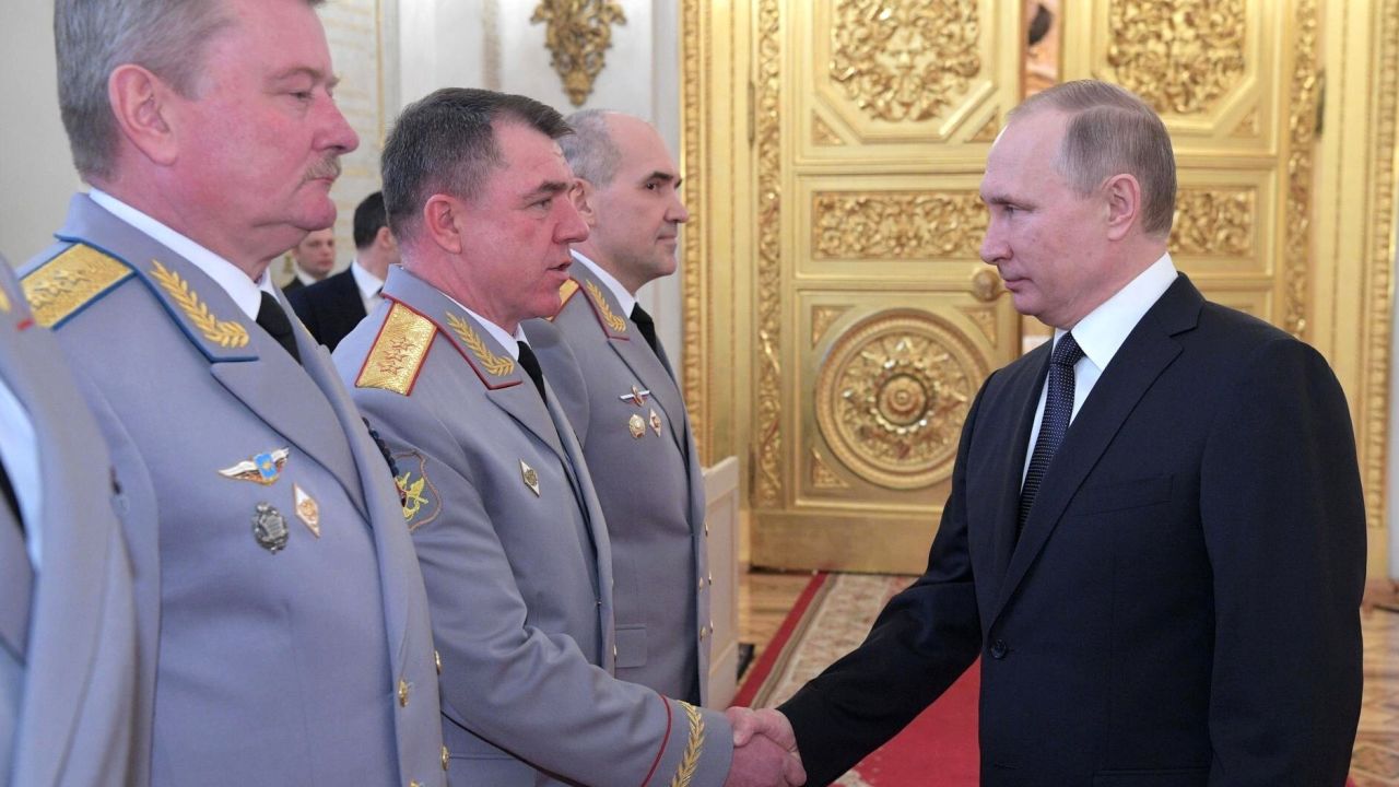 Vladimir Putin shakes hands with Zhuravlyov at the Kremlin in Moscow on March 23, 2017.