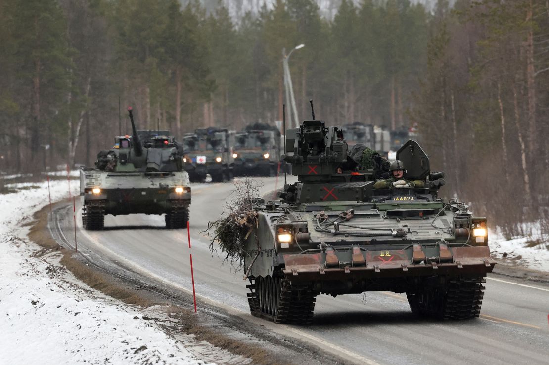 Swedish Army armoured vehicles and tanks participate in a military exercise called "Cold Response 2022", gathering around 30,000 troops from NATO member countries as well as Finland and Sweden, amid Russia's invasion of Ukraine, in Setermoen in the Arctic Circle, Norway, March 25, 2022. 