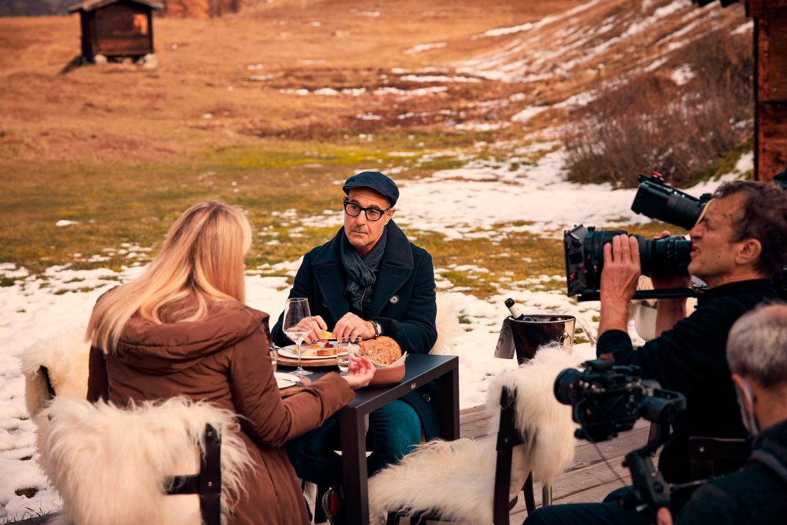 (From left) Sommelier and local teacher Cecilia Lazzarotto and Tucci share a meal of regional specialties from Valle d'Aosta at Alpage Restaurant.