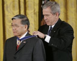 President George W. Bush, right, bestows the Presidential Medal of Freedom to former Transportation Secretary Norman Mineta during a ceremony in the East Room of the White House in Washington on Friday, December 15, 2006.