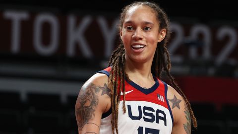Griner watches the US game against Serbia at last year's Olympics in Tokyo. 