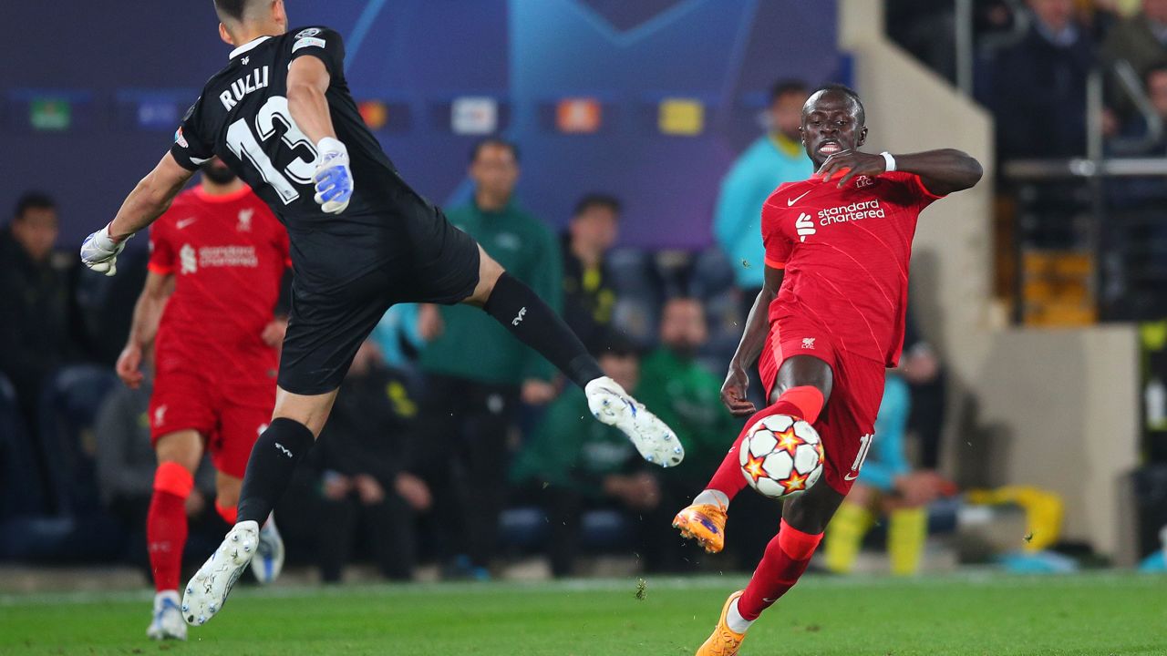 Mane skips round Rulli before scoring Liverpool's third.