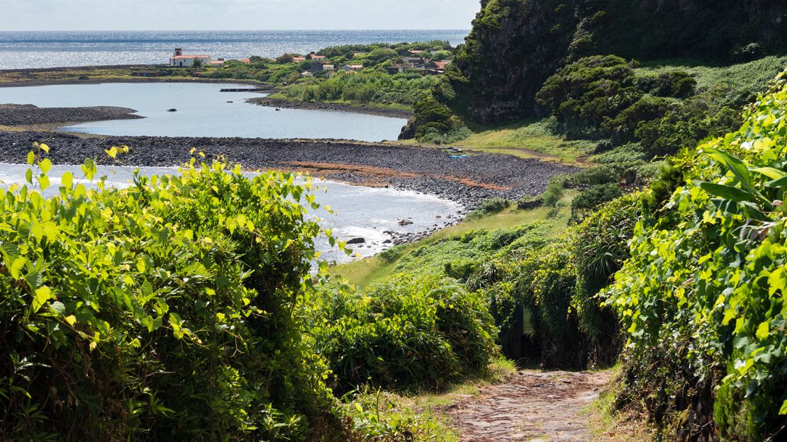 Fajã da Caldeira de Santo Cristo is a fertile plain at the base of a steep slope.