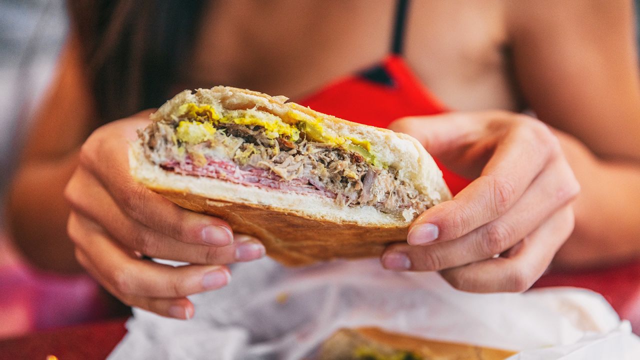 <strong>Cuban sandwich, Cuba/United States: </strong>This pressed sandwich is layered with boiled ham, roasted pork, pickles, mustard, Swiss cheese and butter.
