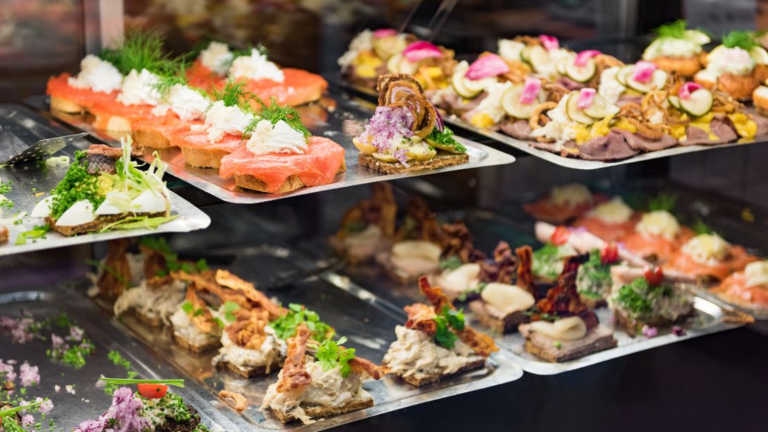 <strong>Smørrebrød, Denmark: </strong>You can find this traditional open sandwich at Copenhagen food market stores. You'll see sandwiches on display with seafood, smoke salmon and meats.